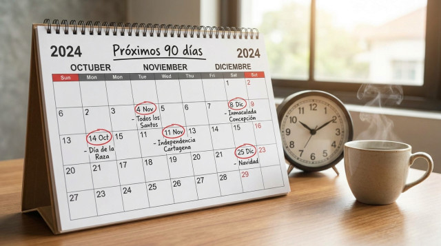 calendario de papel con los festivos marcados en rojo y la frase 